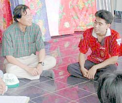 Dr Heong and farmer